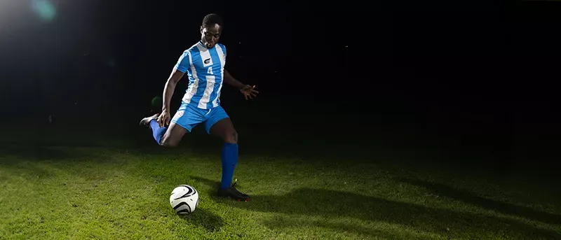 Professional MLS player kicks soccer ball